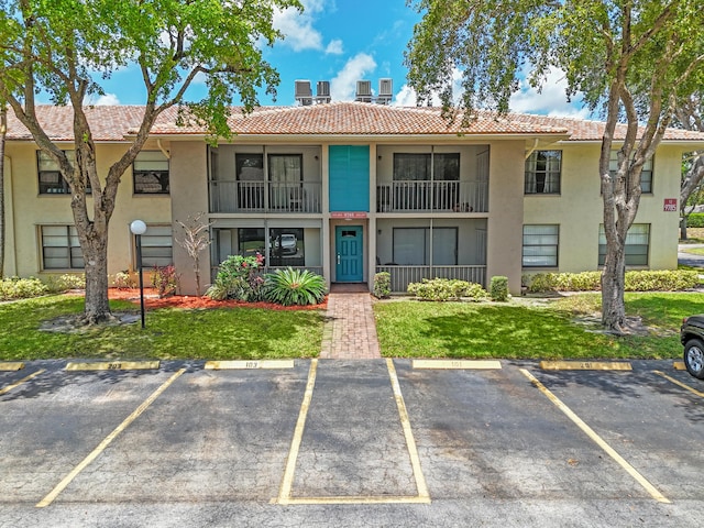 9785 Pineapple Tree Dr Unit 103, Boynton Beach, FL 33436 - view of property with uncovered parking