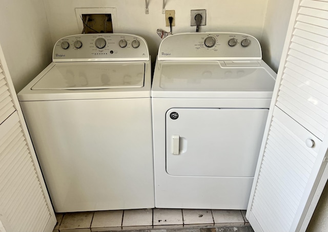 laundry area with separate washer and dryer, laundry area, and tile patterned floors
