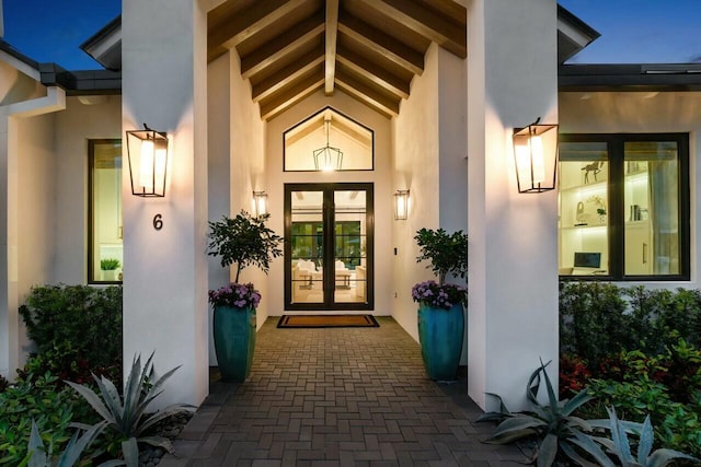 property entrance featuring stucco siding