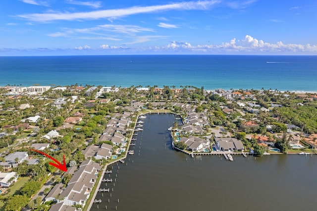 drone / aerial view featuring a residential view and a water view