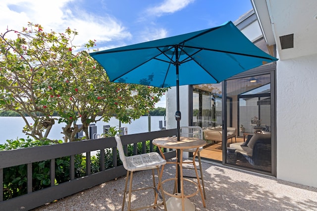 view of patio featuring a balcony