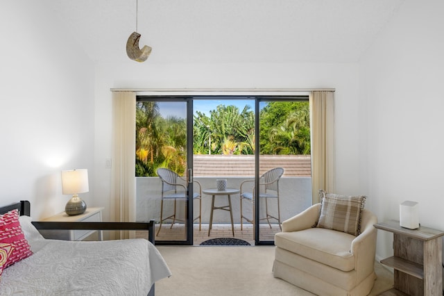 carpeted bedroom featuring access to outside and vaulted ceiling