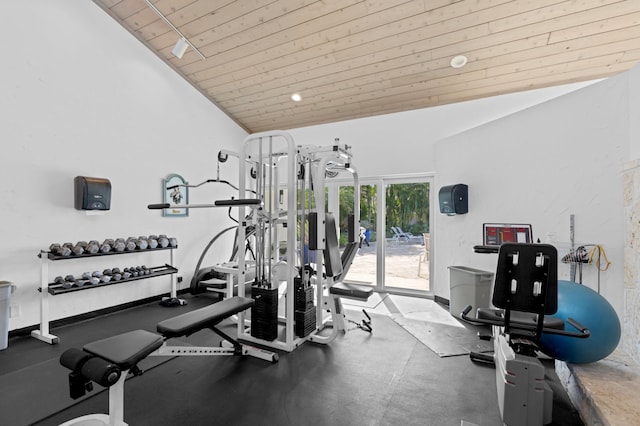 workout area featuring wooden ceiling, vaulted ceiling, and baseboards