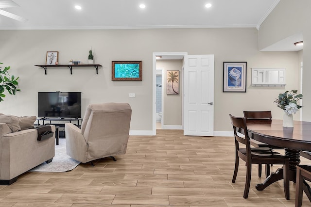 living area with ornamental molding, wood tiled floor, baseboards, and recessed lighting