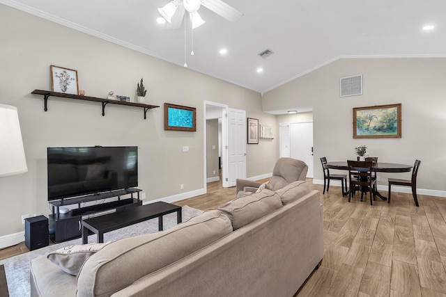 living room with light wood-type flooring, visible vents, lofted ceiling, and baseboards