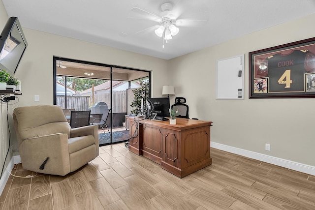 office featuring baseboards, a ceiling fan, and wood finish floors