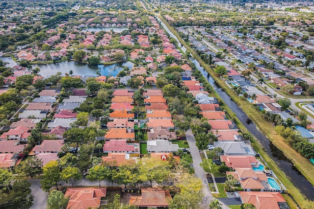 bird's eye view featuring a residential view and a water view