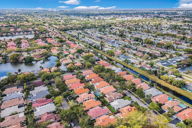 bird's eye view with a water view and a residential view