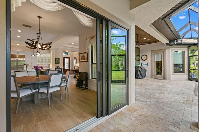 interior space with light wood finished floors, visible vents, a chandelier, and recessed lighting