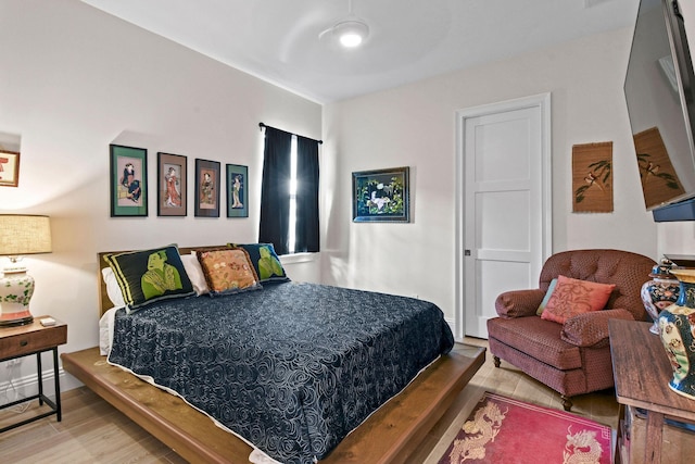 bedroom with wood finished floors