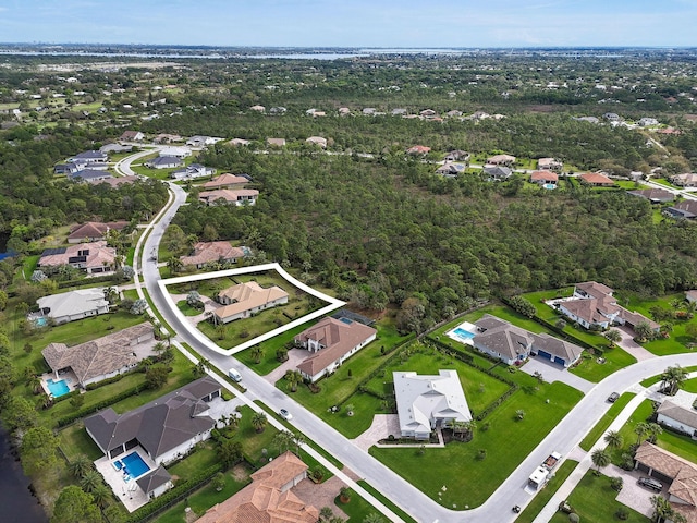 birds eye view of property with a residential view