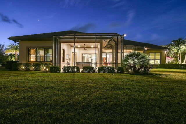 back of house featuring a yard