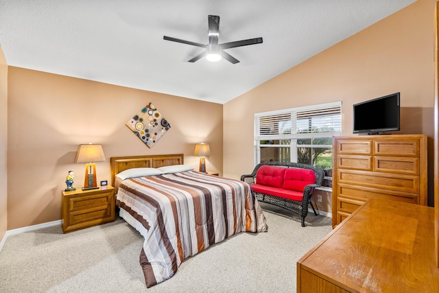 bedroom with a ceiling fan, carpet flooring, vaulted ceiling, and baseboards