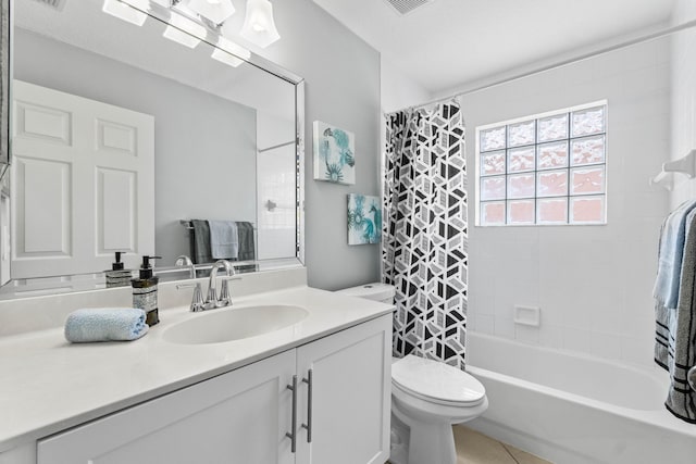 bathroom with toilet, tile patterned floors, shower / bath combination with curtain, and vanity