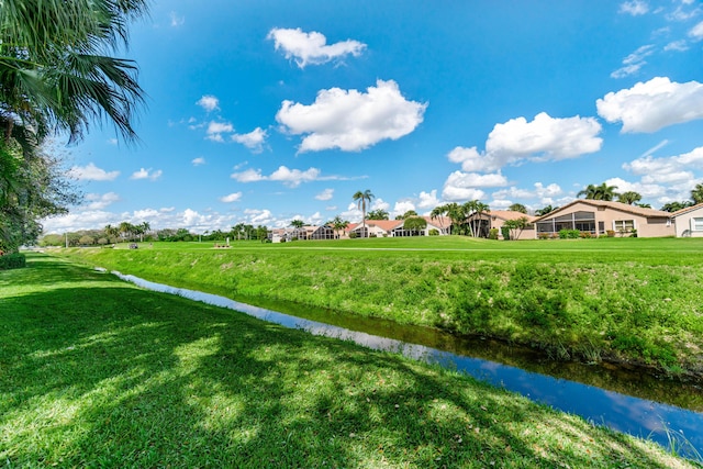 view of property's community featuring a yard