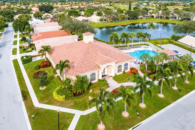 bird's eye view featuring a residential view and a water view