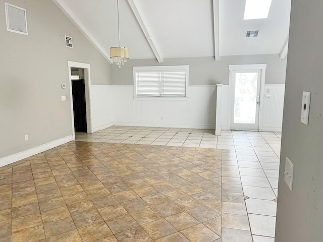 spare room featuring high vaulted ceiling, visible vents, beam ceiling, and wainscoting