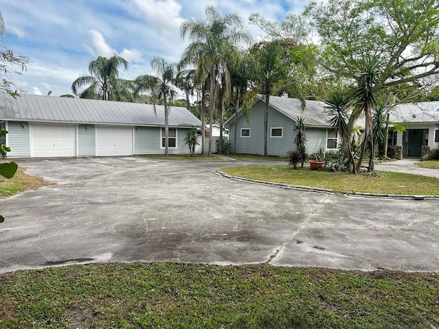 view of front of house with a garage and aphalt driveway