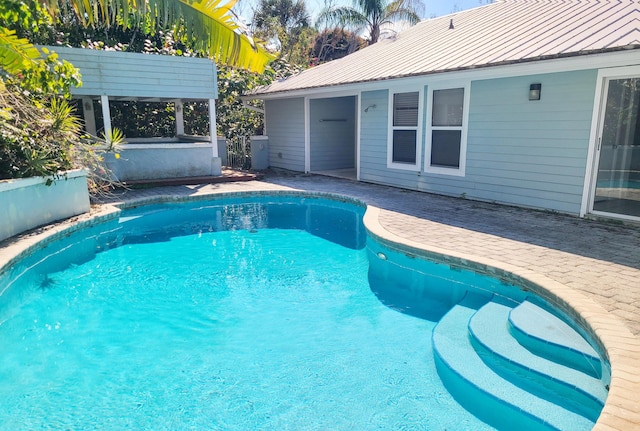 pool with a patio