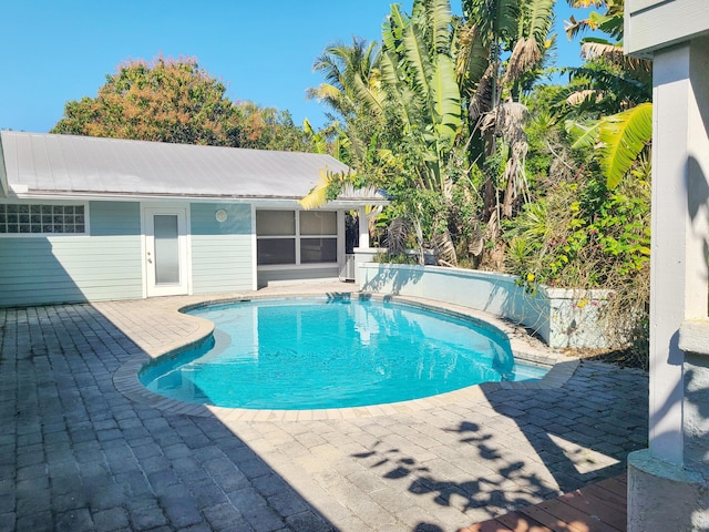 outdoor pool with a patio