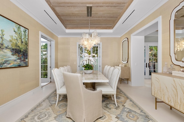 dining room with wooden ceiling, plenty of natural light, a tray ceiling, and a chandelier