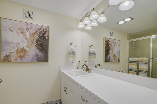 full bath featuring a stall shower, visible vents, and vanity