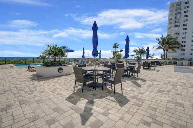 view of patio / terrace featuring a community pool