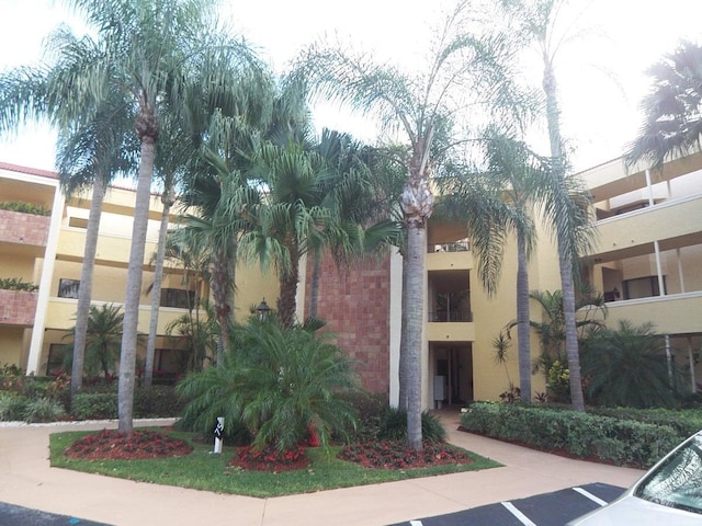 7520 La Paz Blvd Unit 104, Boca Raton, FL 33433 - view of property with uncovered parking