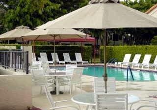 pool featuring a patio area and fence