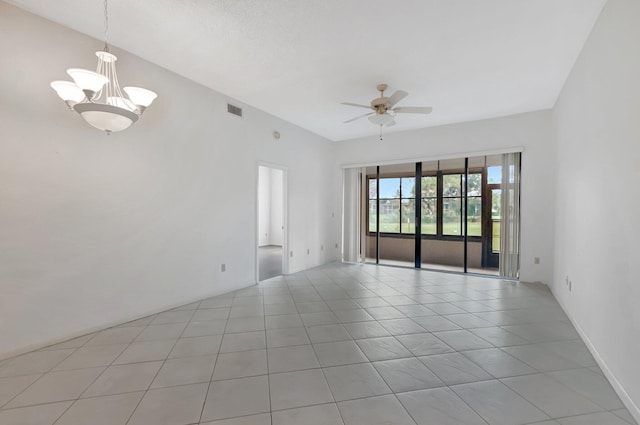 unfurnished room featuring light tile patterned flooring, visible vents, and ceiling fan with notable chandelier