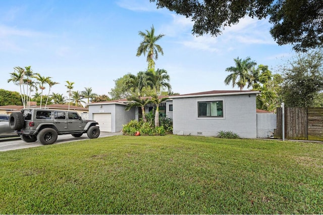 ranch-style home featuring concrete driveway, crawl space, fence, a front lawn, and stucco siding