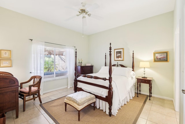 bedroom featuring light tile patterned floors, ceiling fan, and baseboards