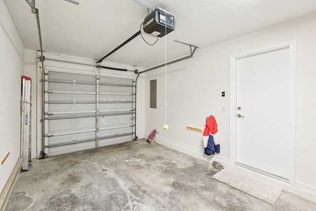 garage with electric panel and a garage door opener