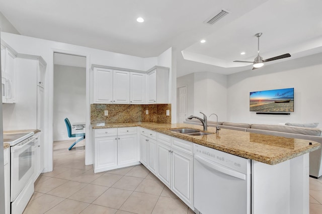 kitchen with white appliances, visible vents, a sink, and light tile patterned floors