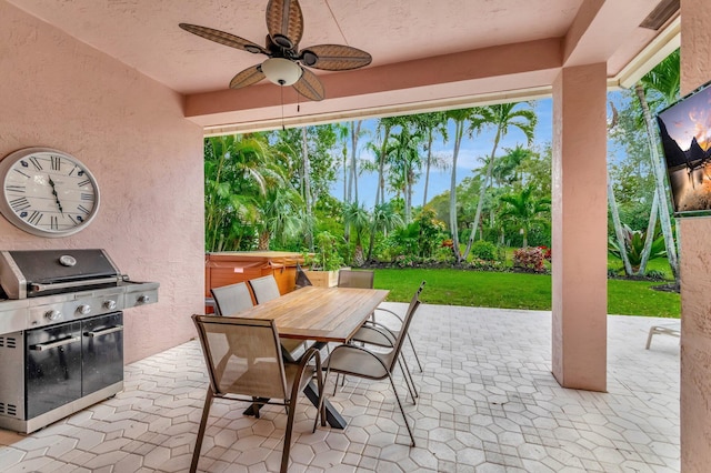 view of patio / terrace featuring ceiling fan, outdoor dining area, and area for grilling