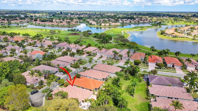 bird's eye view featuring a water view, a residential view, and golf course view