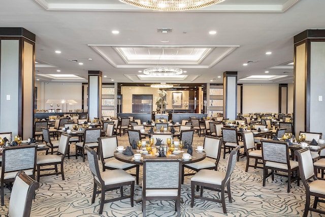 dining area featuring a tray ceiling, carpet, a notable chandelier, recessed lighting, and visible vents