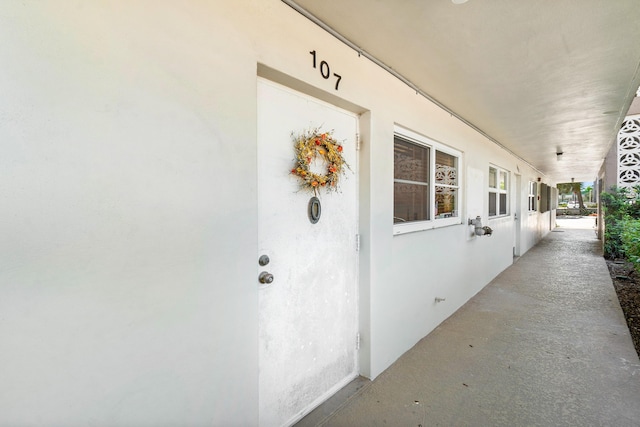 property entrance featuring stucco siding