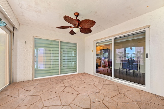 view of patio / terrace featuring a ceiling fan