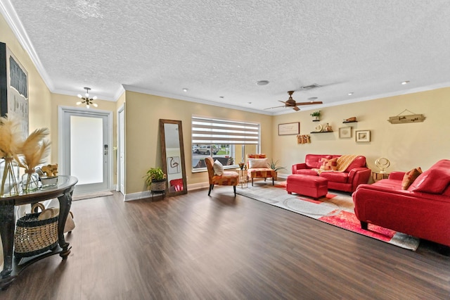 living room featuring visible vents, crown molding, baseboards, and wood finished floors