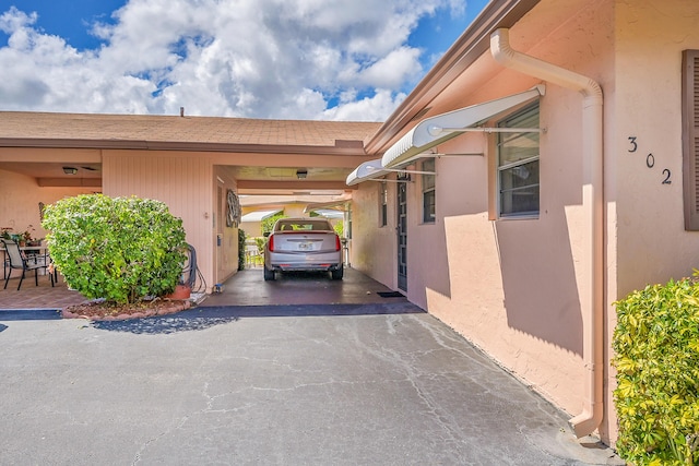 view of car parking with a carport