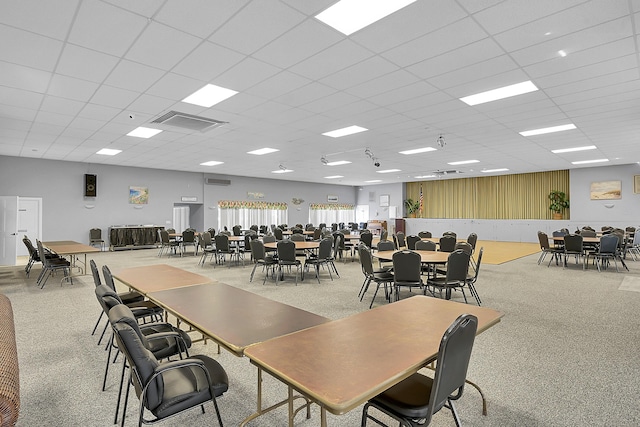 dining room featuring a drop ceiling and visible vents