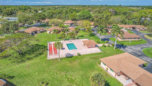 birds eye view of property with a residential view and a wooded view