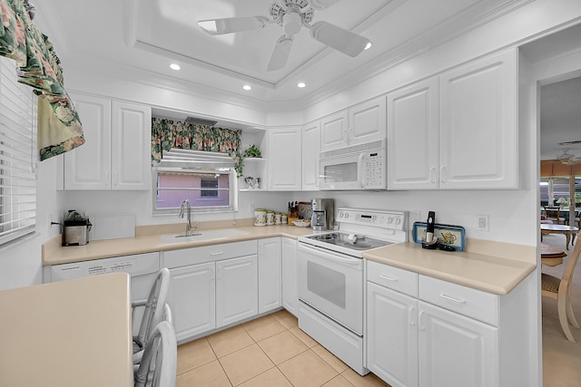 kitchen with ceiling fan, white appliances, white cabinetry, and a sink