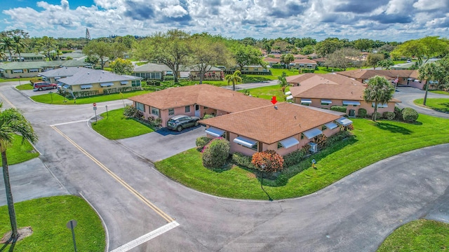 birds eye view of property with a residential view