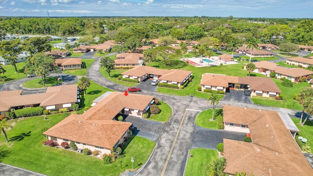 aerial view featuring a residential view and a view of trees