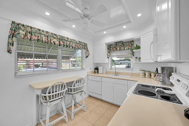 kitchen featuring white appliances, white cabinetry, crown molding, and a sink