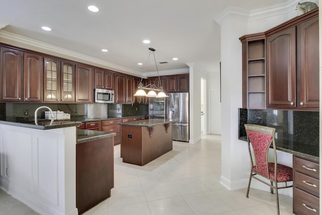 kitchen with a kitchen breakfast bar, stainless steel appliances, crown molding, open shelves, and built in desk