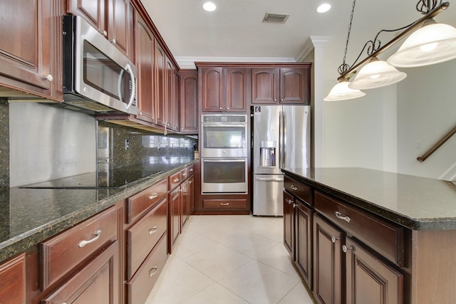 kitchen with light tile patterned floors, stainless steel appliances, visible vents, decorative backsplash, and ornamental molding