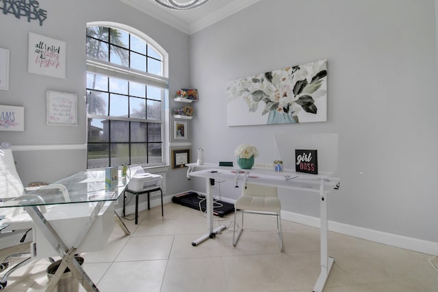 office space featuring baseboards, tile patterned flooring, and crown molding